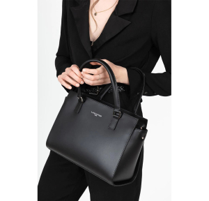 Petit sac trapèze cuir lisse Lancaster Smooth Fabriqué en France 437-03-NOIR Noir porté main par une mannequin