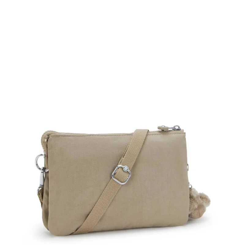 Petit Sac Bandoulière Kipling avec porte clé Riri KPKI75904PW1, couleur Soft Taupe, vue de côté Petit Sac Bandoulière Kipling avec porte clé Riri KPKI75904PW1, couleur Soft Taupe, vue de côté